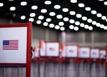 A polling location with voting booths is shown.