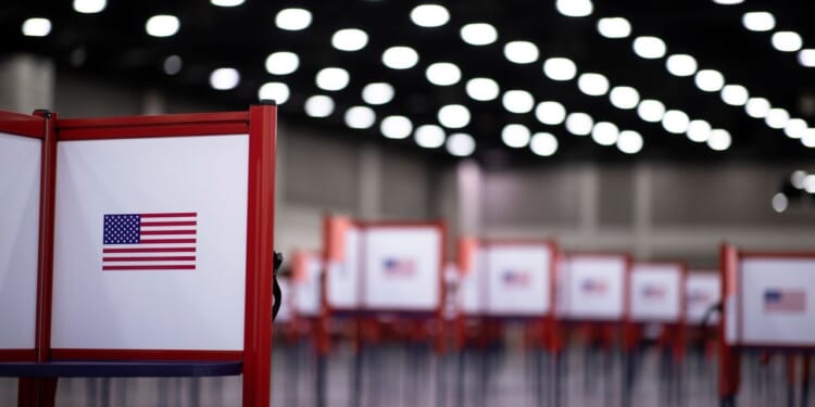 A polling location with voting booths is shown.