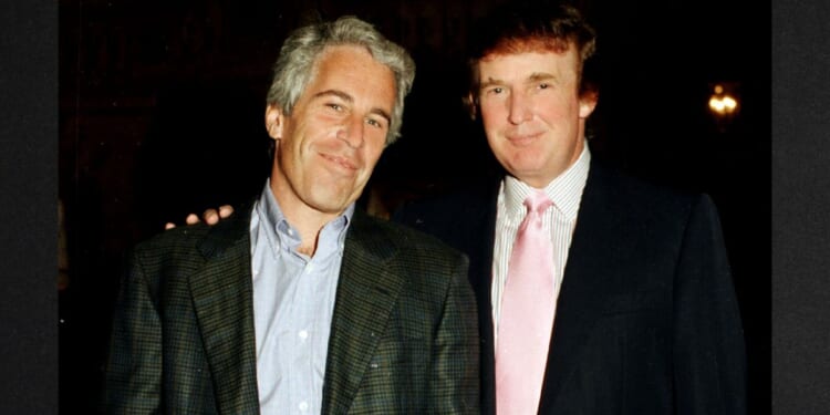 Then-financier Jeffrey Epstein, left, and then-real estate developer Donald Trump pose together at the Mar-a-Lago estate in Palm Beach, Florida, in a file photo dated Feb. 22, 1997. Their relationship soured not long after, and new evidence indicates Epstein was actively trying to find dirt on Trump when he died in prison in 2019.