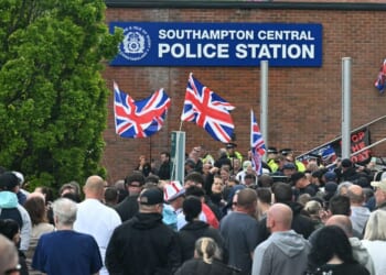 Demonstrators protest Tuesday outside of Southampton Central Police Station in Southampton, southern England, following the conviction of Vickrum Digwa for the murder of Henry Nowak.