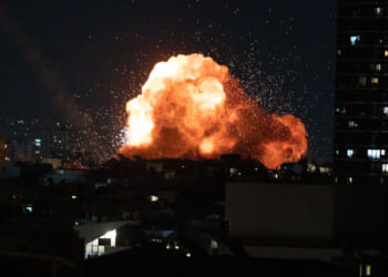This photo taken on Feb. 28, 2026 shows an explosion during missile strikes by Iran in downtown Tel Aviv, Israel.