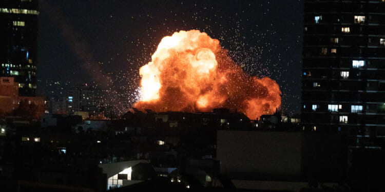 This photo taken on Feb. 28, 2026 shows an explosion during missile strikes by Iran in downtown Tel Aviv, Israel.