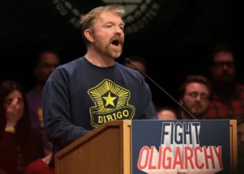 Democratic U.S. Senate candidate Graham Platner of Maine speaks at a “Fighting Oligarchy” tour stop held by Vermont Sen. Bernie Sanders May 24 in Orono, Maine.