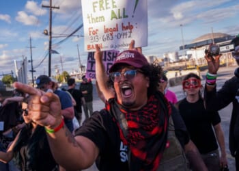 Protesters shout at ICE agents outside the Delaney Hall Immigration Detention Center on June 7, 2026, in Newark, New Jersey.
