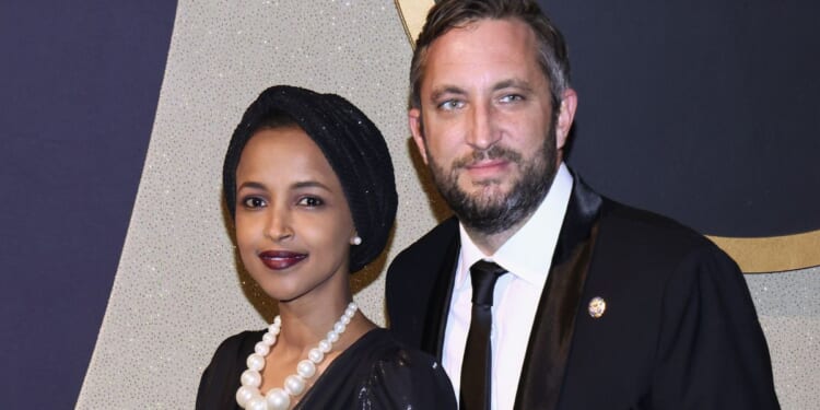 Minnesota Democratic Rep. lhan Omar, left, and Tim Mynett are seen in a file photo attending the Congressional Black Caucus Foundation Annual Legislative Conference Phoenix Awards on Sept. 23, 2023, in Washington, D.C.