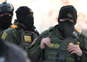 Justice Department sues Philadelphia over anti-ICE mask law