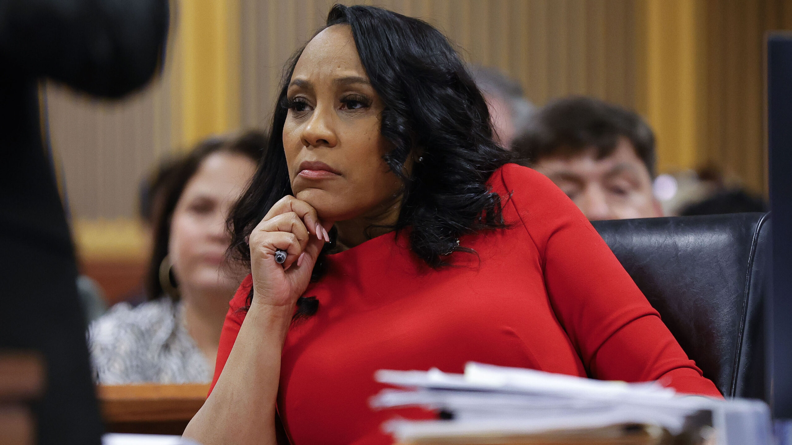 ATLANTA, GA - MARCH 01: Fulton County District Attorney Fani Willis looks on during a hearing in the case of the State of Georgia v. Donald John Trump at the Fulton County Courthouse on March 1, 2024, in Atlanta, Georgia. The hearing is to determine whether Fulton County District Attorney Fani Willis should be removed from the case because of a relationship with Nathan Wade, special prosecutor she hired in the election interference case against former President Donald Trump. (Photo by Alex Slitz-Pool/Getty Images)