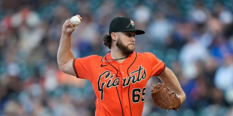 Landen Roupp of the San Francisco Giants pitches against the Chicago Cubs in the top of the first inning at Oracle Park on June 12, 2026, in San Francisco, California.