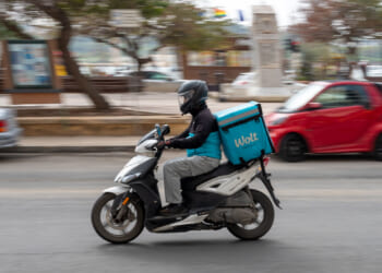 SLIEMA, MALTA - MARCH 8: A Wolt food-delivery rider makes a delivery on a scooter on March 8, 2026 in Sliema, Malta. (Photo by John Keeble/Getty Images)