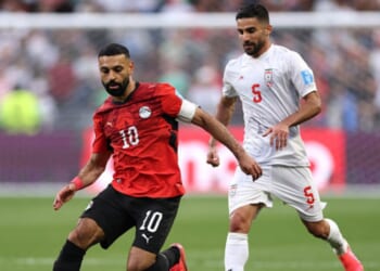 Mohamed Salah, playing for Egypt, and Milad Mohammadi, playing for Iran, play on a soccer field in Seattle, Washington on June 26, 2026.