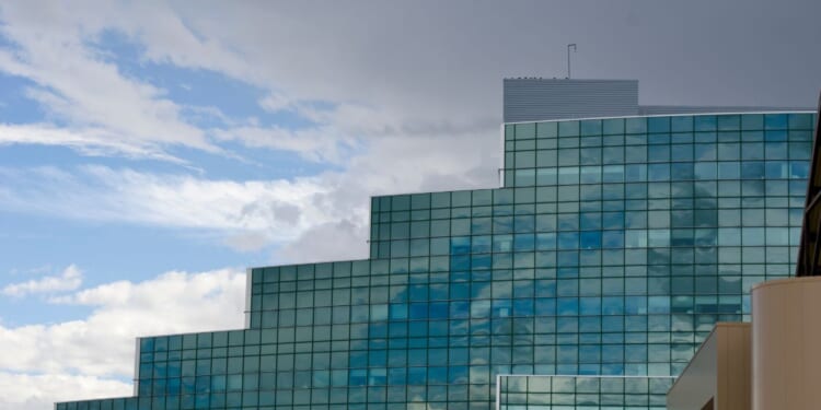 The glass architecture of the National Security Sciences Building at Los Alamos National Laboratory reflects the coming weather.