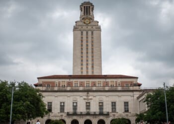 The University of Texas stands behind stormy skies in Austin, Texas on April 26, 2024.