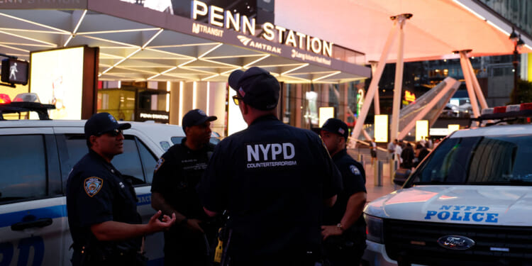 NYPD police officers are seen outside Penn Station in New York on June 7, 2026. Five people were wounded Sunday in a stabbing at New York's Penn Station, according to the city fire department, which said all victims were transported to hospital and the attacker was "in custody." The victims were all civilians, including one person with serious injuries, the New York Fire Department said in a statement. (Photo by John Lamparski / AFP via Getty Images)