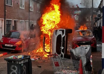 Vehicles burn in fire as riots flared in response to Monday night's stabbing attack in Belfast, Ireland.