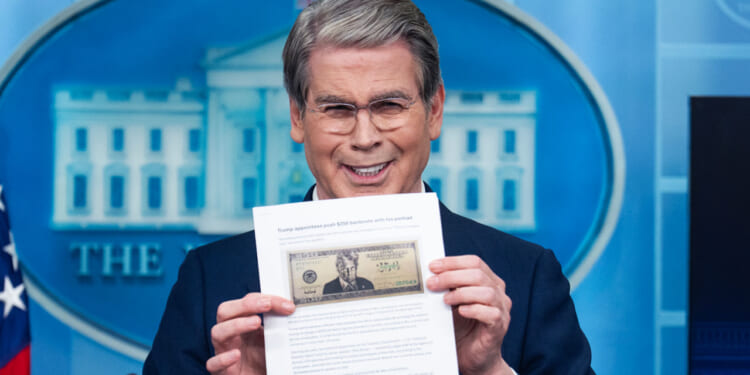 UNITED STATES - MAY 28: Treasury Secretary Scott Bessent holds a printout of a proposed $250 bill featuring a picture of President Donald Trump, during the White House press briefing where he addressed Trump Accounts, the war in Iran, and inflation among other issues, on Thursday, May 28, 2026. (Tom Williams/CQ-Roll Call, Inc via Getty Images)