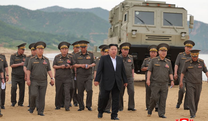 In this photo provided Friday, June 26, 2026, by the North Korean government, its leader Kim Jong Un, center, visits the site of weapon tests at an undisclosed location, North Korea, Thursday, June 25, 2026. Independent journalists were not given access to cover the event depicted in this image distributed by the North Korean government. The content of this image is as provided and cannot be independently verified. Korean language watermark on image as provided by source reads: "KCNA" which is the abbreviation for Korean Central News Agency. (Korean Central News Agency/Korea News Service via AP)