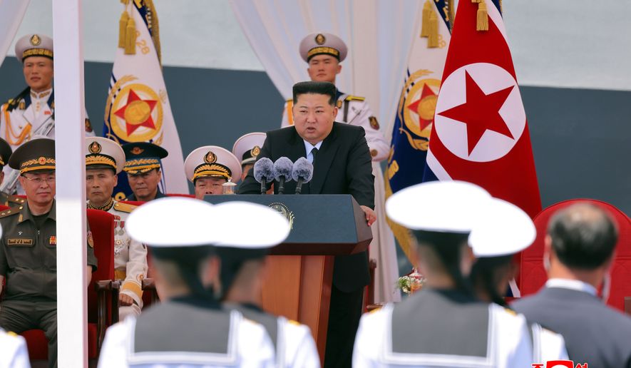In this photo provided Wednesday, June 24, 2026, by the North Korean government, its leader Kim Jong Un, center, speaks during a commissioning ceremony of its destroyer Choe Hyon at the port in Nampo Tuesday, June 23, 2026. Independent journalists were not given access to cover the event depicted in this image distributed by the North Korean government. The content of this image is as provided and cannot be independently verified. Korean language watermark on image as provided by source reads: "KCNA" which is the abbreviation for Korean Central News Agency. (Korean Central News Agency/Korea News Service via AP)