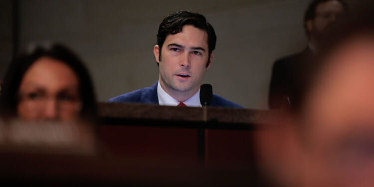 Rep. Brandon Gill looks out from the table as he appears at a House committee hearing.