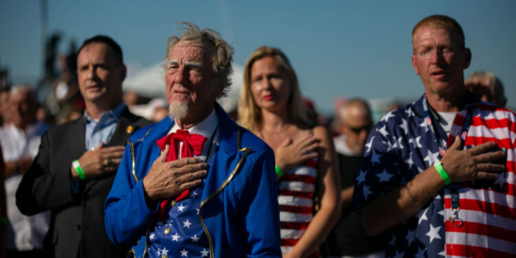 WILMINGTON, NC - SEPTEMBER 23: People says the pledge of allegiance before a Save America rally for former President Donald Trump at the Aero Center Wilmington on September 23, 2022 in Wilmington, North Carolina. The "Save America" rally was a continuation of Donald Trump's effort to advance the Republican agenda by energizing voters and highlighting candidates and causes. (Photo by Allison Joyce/Getty Images)