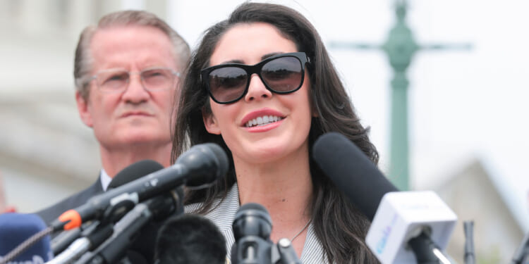 Rep. Anna Paulina Luna, R-Fla. speaks into a bank of microphones,