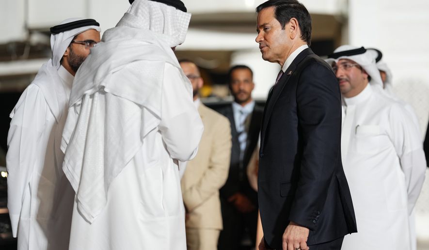 Bahrain's Foreign Minister Abdullatif bin Rashid Al Zayani speaks with U.S. Secretary of State Marco Rubio, right, upon arrival at Bahrain International Airport during his visit to the Middle East to discuss the interim deal between the U.S. and Iran with Arab Gulf allies, in Muharraq, near Manama, Bahrain, Wednesday June 24, 2026. (Eric Lee/Pool Photo via AP)