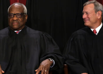 WASHINGTON, DC - OCTOBER 07: United States Supreme Court Associate Justice Clarence Thomas (L) and Chief Justice of the United States John Roberts (R) pose for their official portrait at the East Conference Room of the Supreme Court building on October 7, 2022 in Washington, DC. The Supreme Court has begun a new term after Associate Justice Ketanji Brown Jackson was officially added to the bench in September. (Photo by Alex Wong/Getty Images)