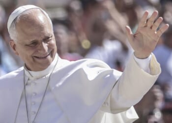 Pope Leo XIV waving and smiling