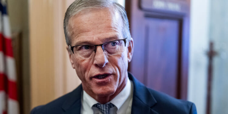 Senate Majority Leader John Thune speaks to reporters in the Capitol.