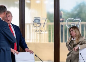 President Donald Trump speaks with German Chancellor Friedrich Merz next to Italian Prime Minister Giorgia Meloni at a working lunch with leaders of G7 and the Middle East, on June 16, 2026, in Evian-les-Bains, France.