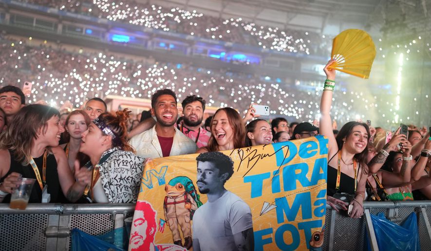 Fans cheer as Bad Bunny performs at Allianz Parque stadium in Sao Paulo, Friday, Feb. 20, 2026. (AP Photo/Andre Penner)