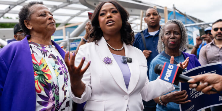 D.C. Ward 4 Council member Janeese Lewis George, candidate for D.C. mayor, addresses supporters to Prince Hall Masonic Temple, a polling location, to vote in Washington, D.C. on Monday, June 8, 2026.