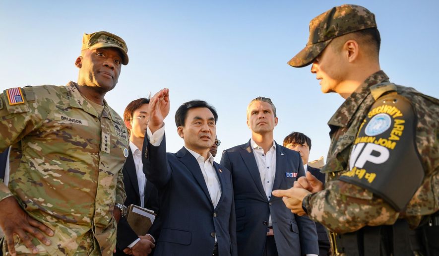 In this photo provided by the South Korea Defense Ministry, U.S. Defense Secretary Pete Hegseth, center right, and South Korean Defense Minister Ahn Gyu-back, center left, visit the Observation Post Ouellette near the border village of Panmunjom, South Korea, Monday, Nov. 3, 2025. (South Korea Defense Ministry via AP) ** FILE **