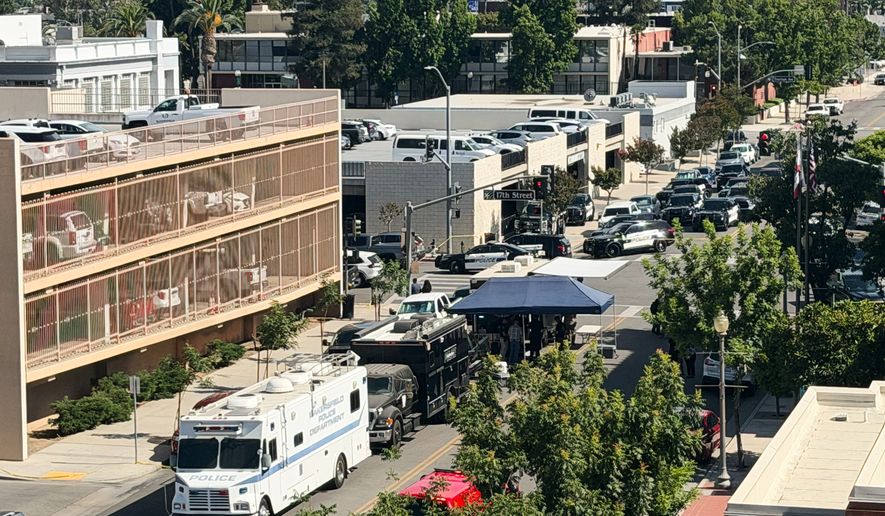 An overhead view shows the scene of a standoff after a man barricaded himself inside a bank on Tuesday, June 2, 2026 in Bakersfield, Calif. (Jacob, Dad’s Gone Live via AP)