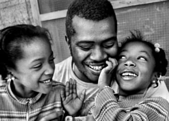 Father with his two daughters.