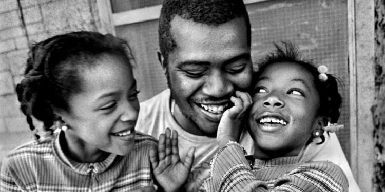 Father with his two daughters.