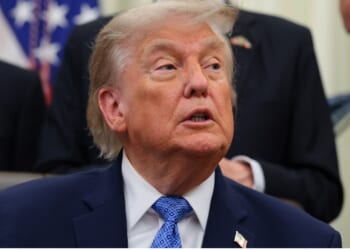 President Donald Trump seated