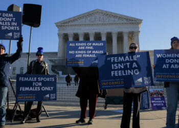 WASHINGTON, DC - JANUARY 13: Protesters who align with the Democratic Party but are against transgender athletes competing in women's sports gather outside the Supreme Court on January 13, 2026 in Washington, DC. Groups from both sides of the debate gathered on Tuesday morning to protest while two cases that prohibit transgender girls from joining girls' and women's sports teams are heard inside the Supreme Court. (Photo by Heather Diehl/Getty Images)