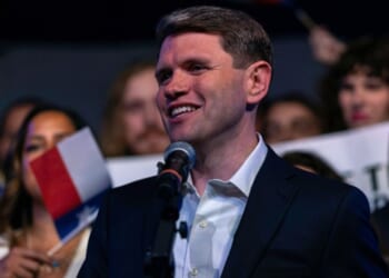 James Talarico stands among a cheering crowd on a campaign stop to Austin, Texas on March 3, 2026.