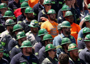 Workers listen as US Vice President JD Vance speaks, during a tour of Nucor Steel Berkeley in Huger, South Carolina, on May 1, 2025. (Photo by Kevin Lamarque / POOL / AFP) (Photo by KEVIN LAMARQUE/POOL/AFP via Getty Images)