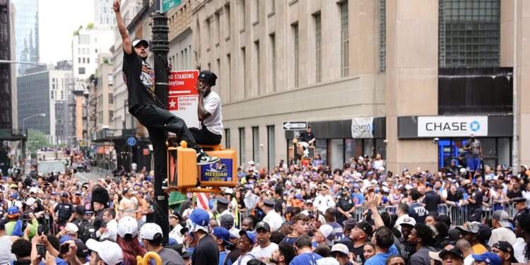 Fans line the street during the New York Knicks Championship ticker tape parade and victory rally celebrating winning the 2026 NBA Finals on June 18, 2026, in New York City.