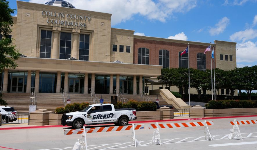 A Collin County seriff drives past the front of the county courthouse Thursday, June 4, 2026, in McKinney, Texas. (AP Photo/Tony Gutierrez)