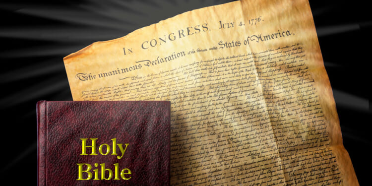 The Bible rests on a copy of the Declaration of Independence