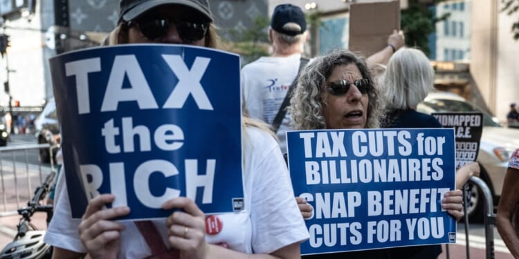A coalition of activist groups participates in a demonstration against the "Big Beautiful Bill" in front of Trump Tower on July 4, 2025, in New York City.