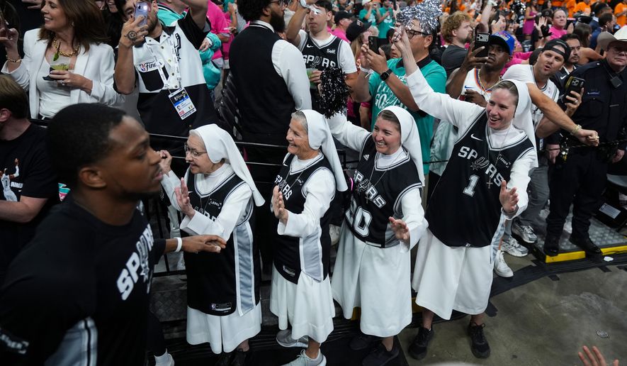 The Salesian Sisters greet players prior to Game 1 of the NBA Finals basketball series between the New York Knicks and the San Antonio Spurs, Wednesday, June 3, 2026, in San Antonio. (AP Photo/Eric Gay)