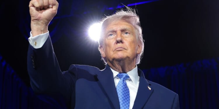 President Donald Trump pumps his fist at the Faith & Freedom Coalition's 2026 Policy Conference in Washington on June 26, 2026.