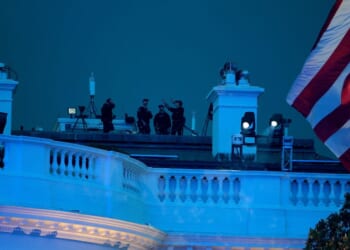 Secret Service agents are seen atop the White House during UFC Freedom 250 on the South Lawn on June 14, 2026, in Washington, D.C.