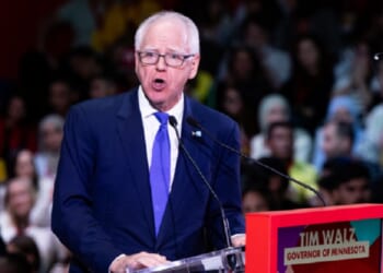 Minnesota Gov. Tim Walz, pictured speaking at a progressive political convention in Barcelona, Spain, in April.