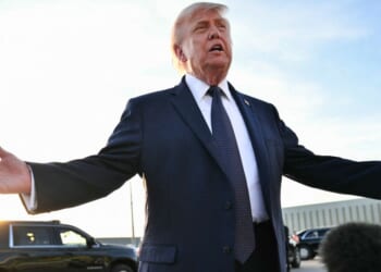 President Donald Trump gestures as he addresses the media on the tarmac after arriving at Paris Orly Airport en route to a dinner to celebrate the 250th anniversary of the independence of the United States, at Orly Airport, south of Paris, on June 17, 2026.