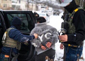 A man is detained by a Border Patrol agent in a file photo dated Jan. 21 in Minneapolis, Minnesota.