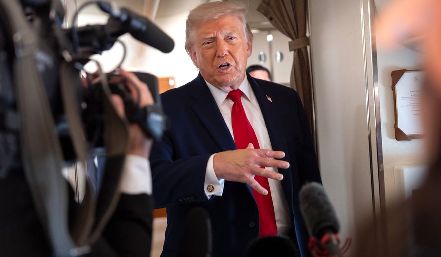 President Donald Trump speaks to reporters aboard Air Force One en route from Joint Base Andrews, Md., to Eau Claire, Wis., Friday, June 5, 2026. (AP Photo/Mark Schiefelbein)